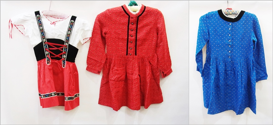 An Austrian child's red dress with Kibek label, another similar in blue and a traditional Austrian