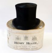 A black top hat, by Henry Heath in original card fitted hat box, marked Henry Heath, etc. with a
