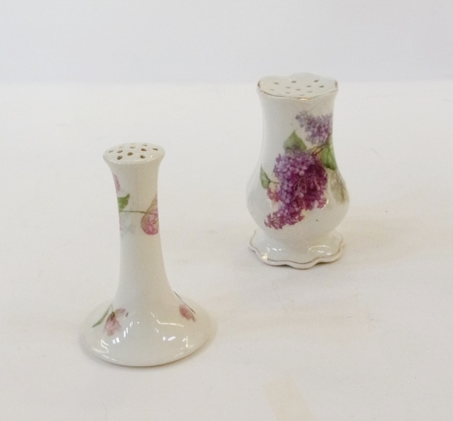 A Victorian hatpin holder, decorated with sprays of white flowers together with another, decorated