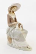 Lladro figure of a lady seated with a dog, 33cm high