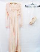 A 1930's apricot panne velvet gown, ribbon detail and a tied bow to the back, with a pair lace and