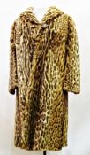 A vintage ocelot fur coat (some wear to collar and sleeves)