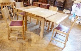 1930's Heals-style draw-leaf dining table, possibly walnut, the table with scroll ends on straight