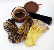 A leather stiff collar case containing collars, various gloves including a pair of fur and leather