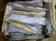 Large quantity assorted men's shirts in their packaging