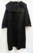 A black Persian lamb coat