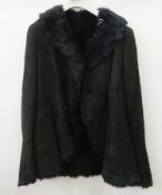 An "Armani" shearling black flared coat, with bell sleeves, still with two spare buttons