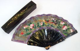 Late 19th/early 20th century Chinese lacquer and paper fan the black lacquer with silver and gilt