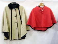 A cream and black velvet trimmed Loden cape, with metal buttons, black lining with flower detail and