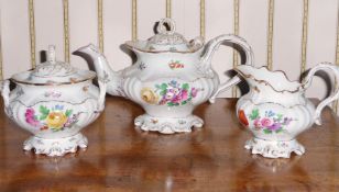 A 19th century part Old English tea service with gilded rims and floral sprigs and another part