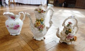 Two large ceramic vases, both in the form of a tea and coffee pot, high-relief floral mouldings