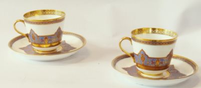 A pair of Davenport porcelain cups and saucers, with foliate giltwork, no decoration, marked "