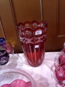 Cranberry cut and flashed glass vase, scalloped edge, enamelled and tapering with circular and slash