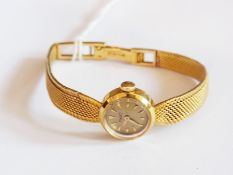 A lady's Piaget 18ct gold cocktail wristwatch with baton numerals and 18ct gold bracelet, No.6412