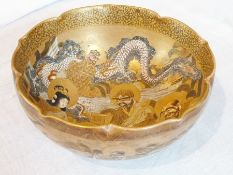 Satsuma pottery bowl, circular with serpentine rim, decorated and jewelled allover deities and