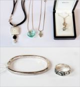 A silver bangle, four silver pendants and chains and a silver ring (1 box)