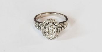 18ct white gold diamond cluster ring in oval setting