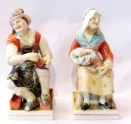 A large pair of 19th century Staffordshire figures, the cobbler and his wife, overall decoration,