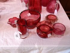 Five cranberry and clear glass sugar basins and cranberry and clear glass cream jug