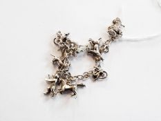 Sterling silver charm bracelet, having nine animal and other charms, 32 grams approximately