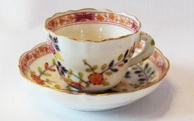Meissen porcelain cabinet cup and saucer, cream ground, red floral border, foliate decorated