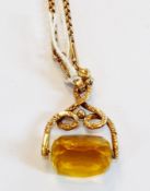 Victorian gold-coloured metal and citrine revolving fob with three sided cut stone, on Victorian 9ct