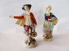 A pair of Sampson male and female porcelain figure in the Chelsea style, 23cm high