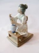 Lladro porcelain figure of a kneeling woman in traditional Japanese dress (af), German porcelain