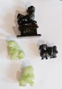 Pair modern oriental jade style temple dogs on wooden stand, 8cm high and small black carved