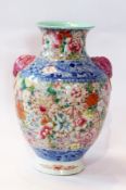 Chinese porcelain vase, polychrome floral decoration with pink elephant mask handles, inverse