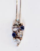 9ct white gold pendant set cabochon moonstones, sapphires and tiny diamonds and a 9ct white-gold