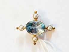 Gold-coloured metal aquamarine and seed pearl pendant set oval cut aquamarine and four pearls in