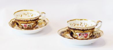 An early 19th century part teaset, the handpainted floral decoration with gilt surrounds within a