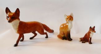 Beswick model of a standing fox, Beswick small seated fox and a USSR model of a seated fox (3)