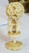 Japanese ivory puzzle ball, the ball carved with dragons, on stand of three elephants, on circular
