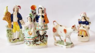 Small collection of 19th century Staffordshire figurines to include cow creamer, Scottish couple,