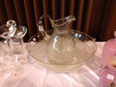 Late Victorian/Edwardian cut glass ewer and basin, the baluster-shaped ewer with panelled neck,