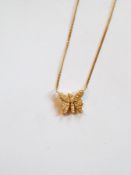 Gold and pave set diamond butterfly pendant on integral fine curblink chain