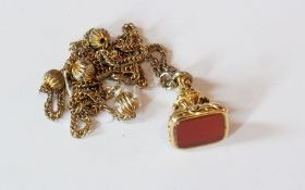 19th century gold-coloured metal and cornelian seal, foliate carved with later modern chain