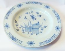 Late 18th century Liverpool delft charger, depicting a pheasant in a floral surround, diameter 30cm
