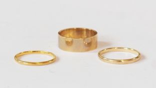 Two 9ct gold wedding bands, and another 9ct gold wide wedding band (3)