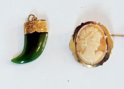 Cameo brooch in 9ct gold mount, and a jade pendant in the shape of a claw with gold-coloured