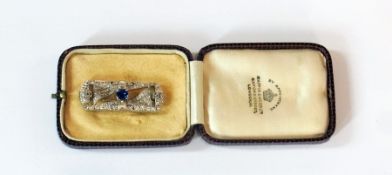 Art Deco diamond brooch with central sapphire in a platinum setting, in box
