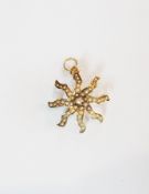 Gold seed pearl and diamond pendant/brooch in the form of a starfish centred by solitaire tiny