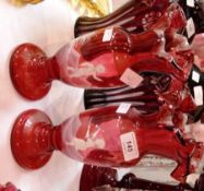 Pair Victorian Mary Gregory style cranberry glass vases, each with frilled everted rim, painted in