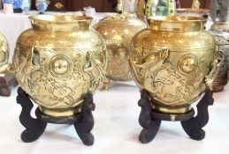 Pair Chinese brass vases, cylindrical shaped, with relief decoration of dragons, engraved decoration