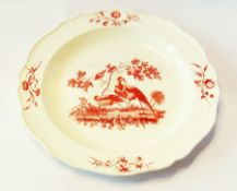 18th century creamware plate, with a serpentine border, decorated with game birds in red, 20cm