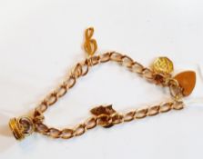 9ct rose gold oval link charm bracelet with small seal charm and three other charms, 21.9g approx.
