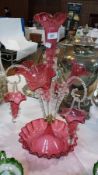 Victorian cranberry and clear glass epergne, with central trumpet flute, three smaller curved flutes