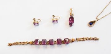 Gold-coloured metal and Alexandrite-coloured stone suite comprising:- bracelet, set with five